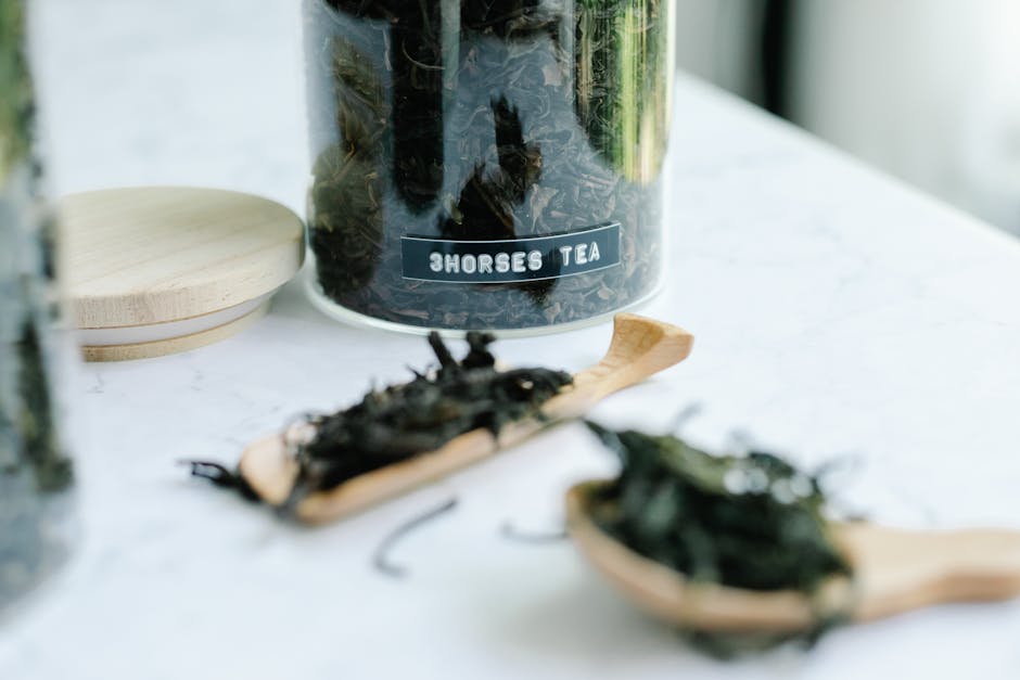 Premium natural tea leaves carefully arranged showcasing the authentic quality and artisanal craftsmanship of traditional tea cultivation